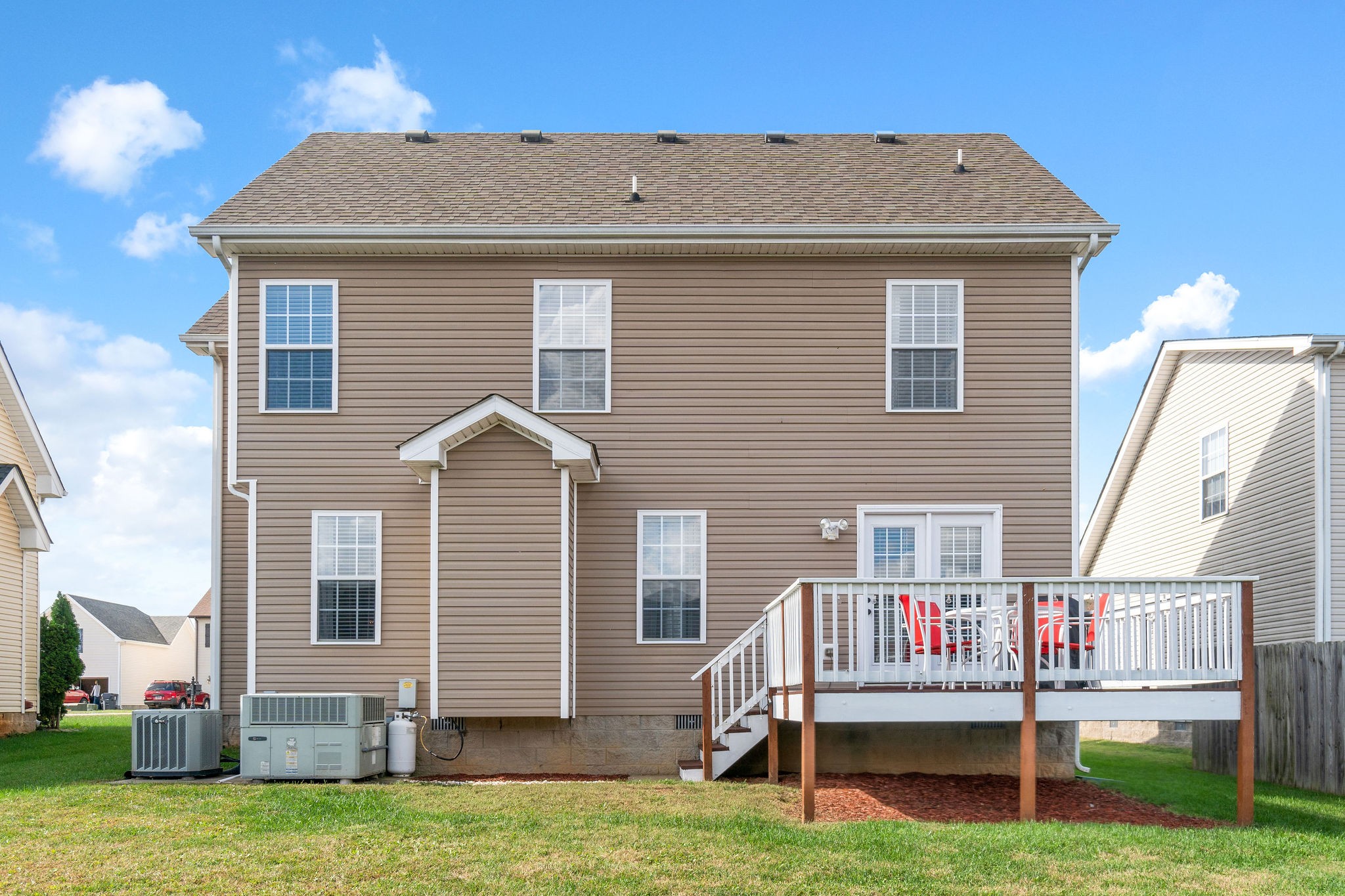 3743 Suiter Road Clarksville, TN 37040 - Photo 28 of 32 a view of a house with a wooden deck and a yard