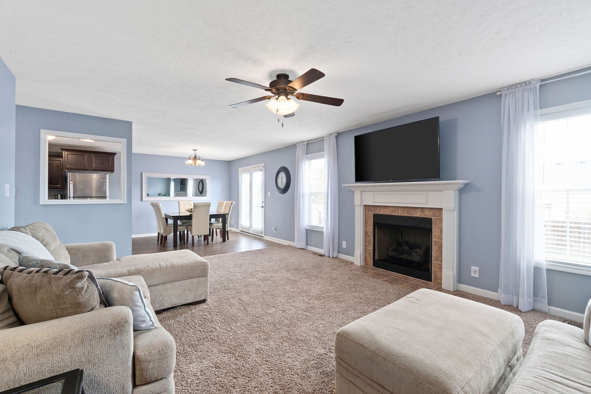 3743 Suiter Road Clarksville, TN 37040 - Photo 8 of 32 a living room with furniture a flat screen tv and a fireplace