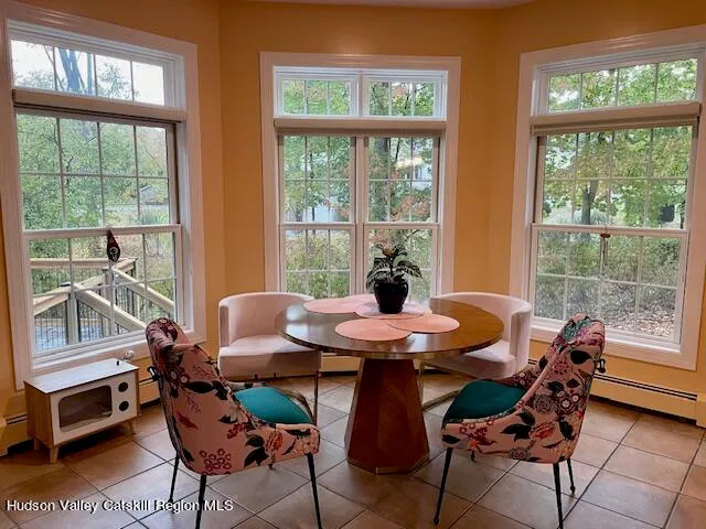 a view of hallway with wooden floor and stairs