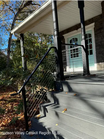a view of a door of the house and front of a house