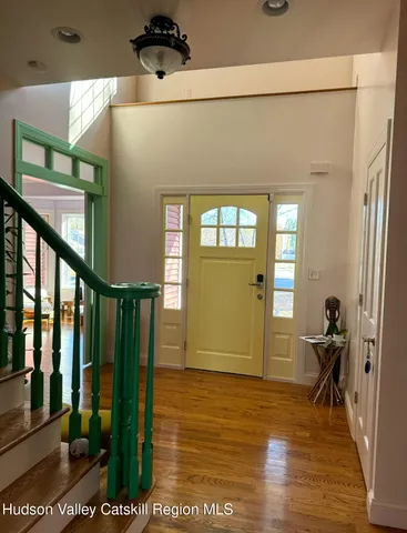 a kitchen with a stove a refrigerator and a fireplace