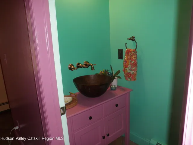 a view of a kitchen with a sink and cabinets