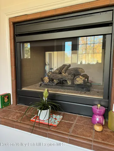 a living room with a couch and a dresser