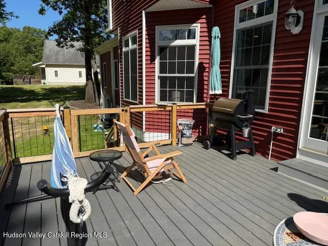 a view of a chairs and table in the balcony