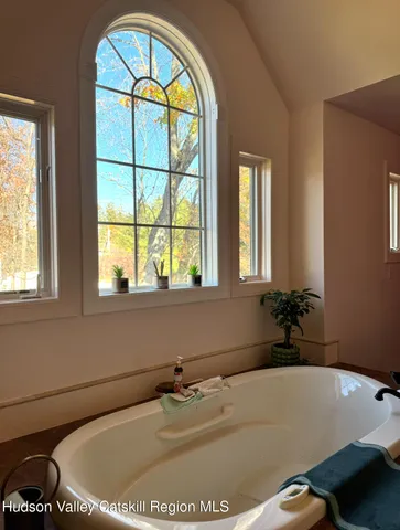 a room with furniture and a large window