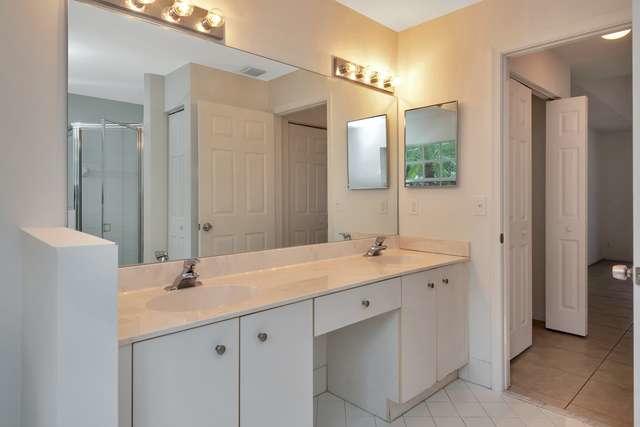 4821 North Lee Road Delray Beach, FL 33445 - Photo 18 of 33 a bathroom with a sink and a mirror