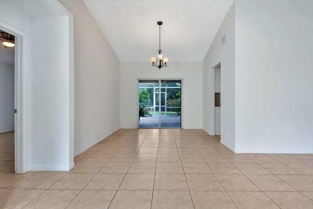 4821 North Lee Road Delray Beach, FL 33445 - Photo 2 of 33 wooden floor in an empty room with a window