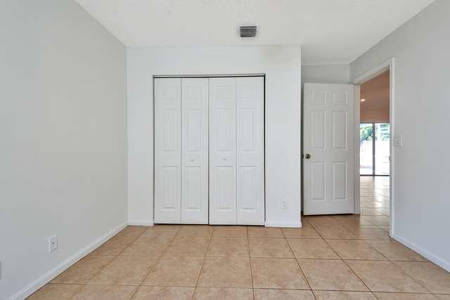 4821 North Lee Road Delray Beach, FL 33445 - Photo 22 of 33 an empty room with windows