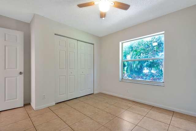 4821 North Lee Road Delray Beach, FL 33445 - Photo 24 of 33 a view of an empty room with window and chandelier fan