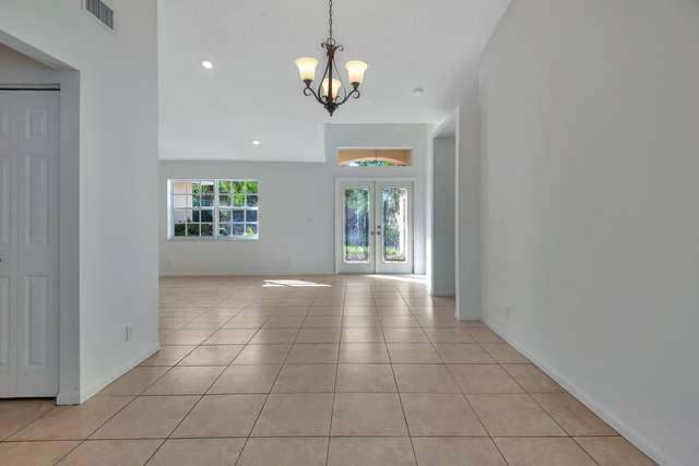 4821 North Lee Road Delray Beach, FL 33445 - Photo 4 of 33 a view of an empty room with a window