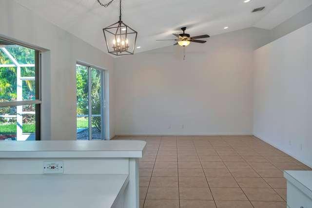 4821 North Lee Road Delray Beach, FL 33445 - Photo 5 of 33 a view of an empty room with a window