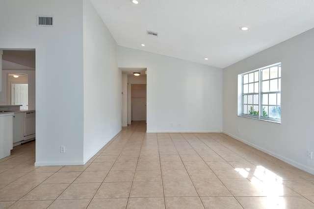 4821 North Lee Road Delray Beach, FL 33445 - Photo 7 of 33 a view of an empty room with a window