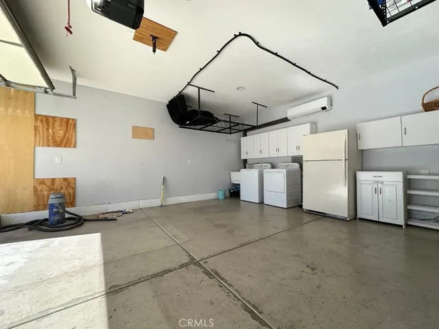 a view of a kitchen with appliances and cabinets