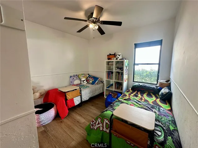 a bedroom with bed and a window