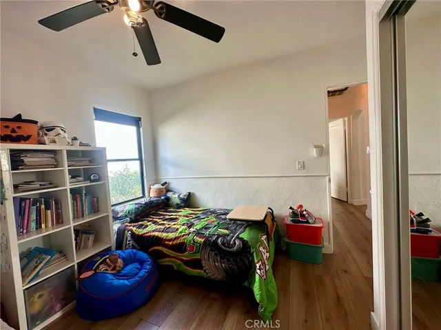 a bedroom with a bed and closet