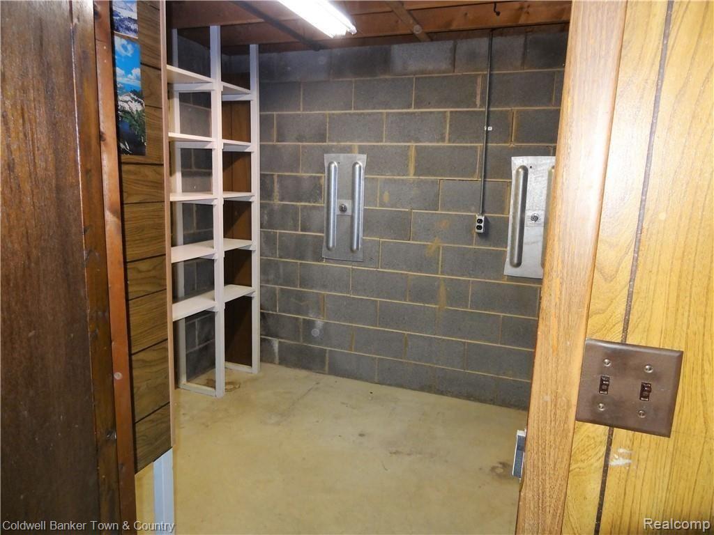 4651 Maybee Road Clarkston, MI 48348 - Photo 24 of 45 Interior storage complete with shelving.