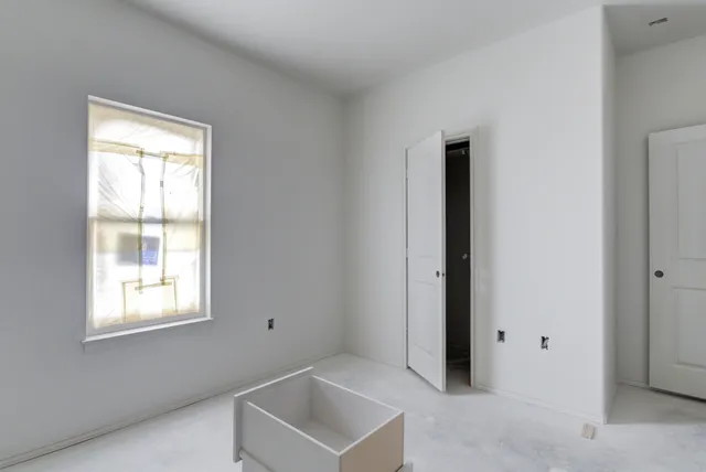 an empty room with windows