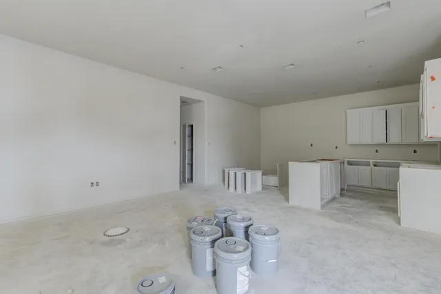 a view of kitchen with white cabinets