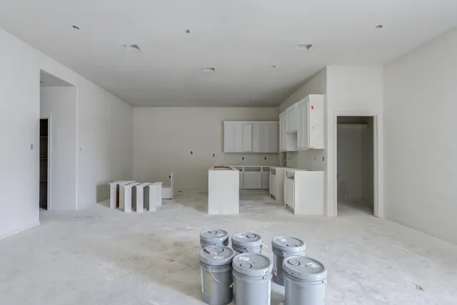 a kitchen with a sink and breakfast area