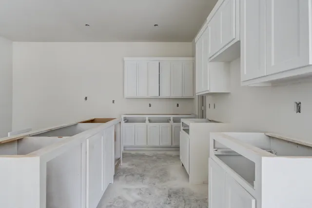 a view of a kitchen with cabinets