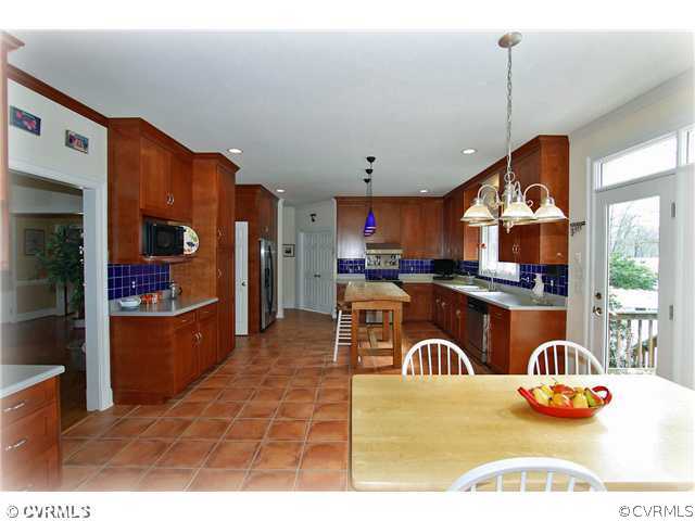 2720 Arrandell Road Midlothian, VA 23113 - Photo 3 of 17 a kitchen with stainless steel appliances granite countertop a refrigerator a stove and a sink with wooden floor