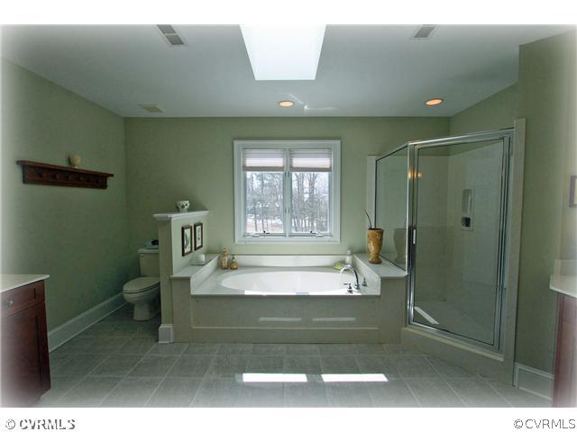 2720 Arrandell Road Midlothian, VA 23113 - Photo 10 of 17 a spacious bathroom with a tub and sink