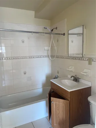 a bathroom with a sink and a shower