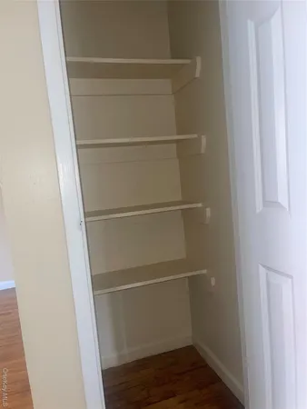 a view of an empty walk in closet