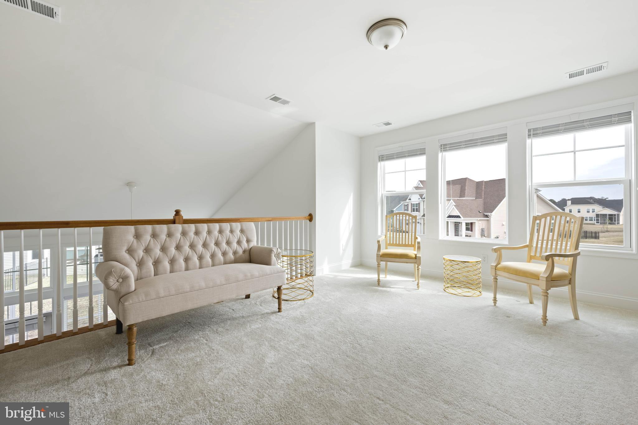 25304 Razorbill Court Millsboro, DE 19966 - Photo 16 of 45 a view of livingroom with furniture and windows