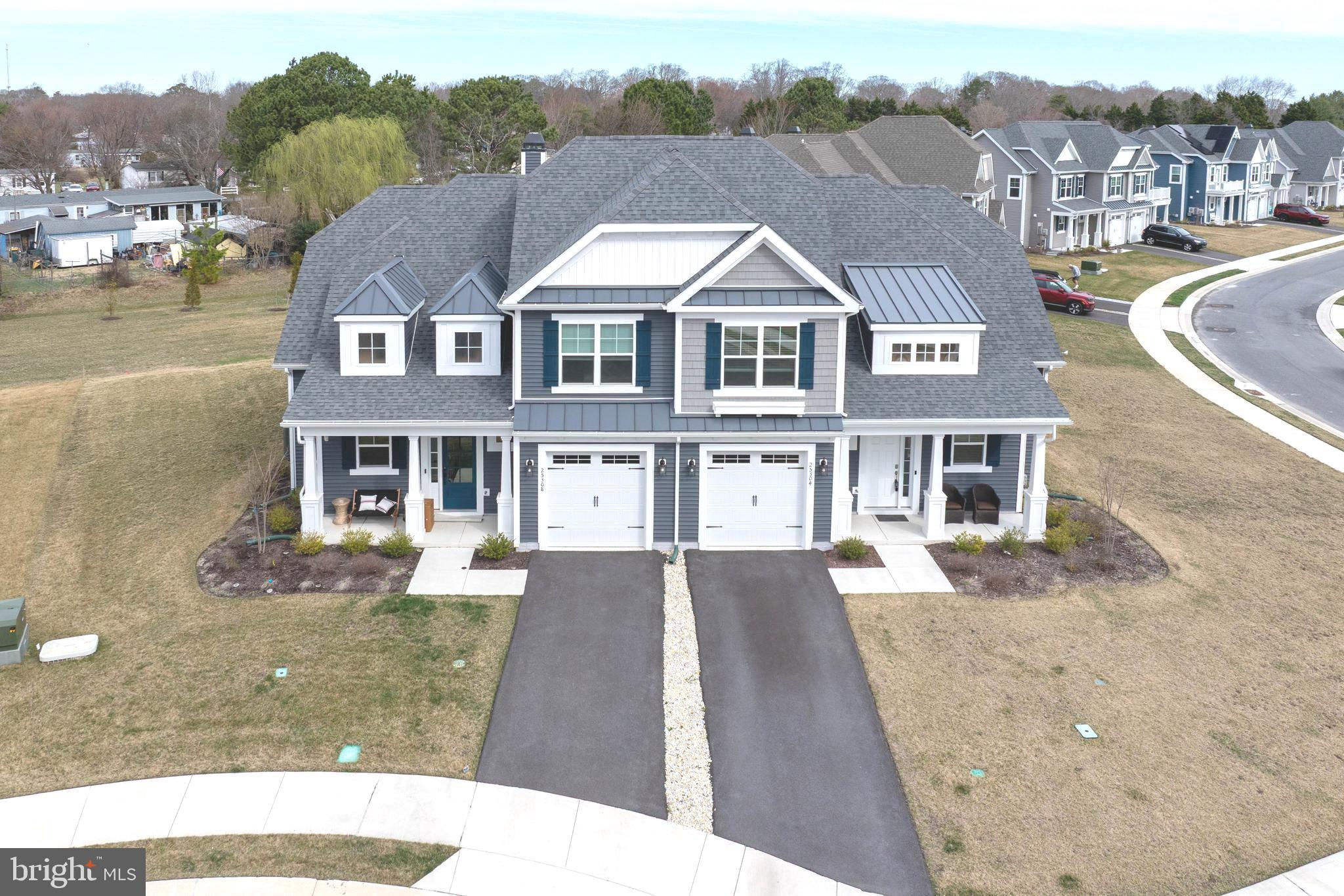 25304 Razorbill Court Millsboro, DE 19966 - Photo 2 of 45 a aerial view of a house next to a yard