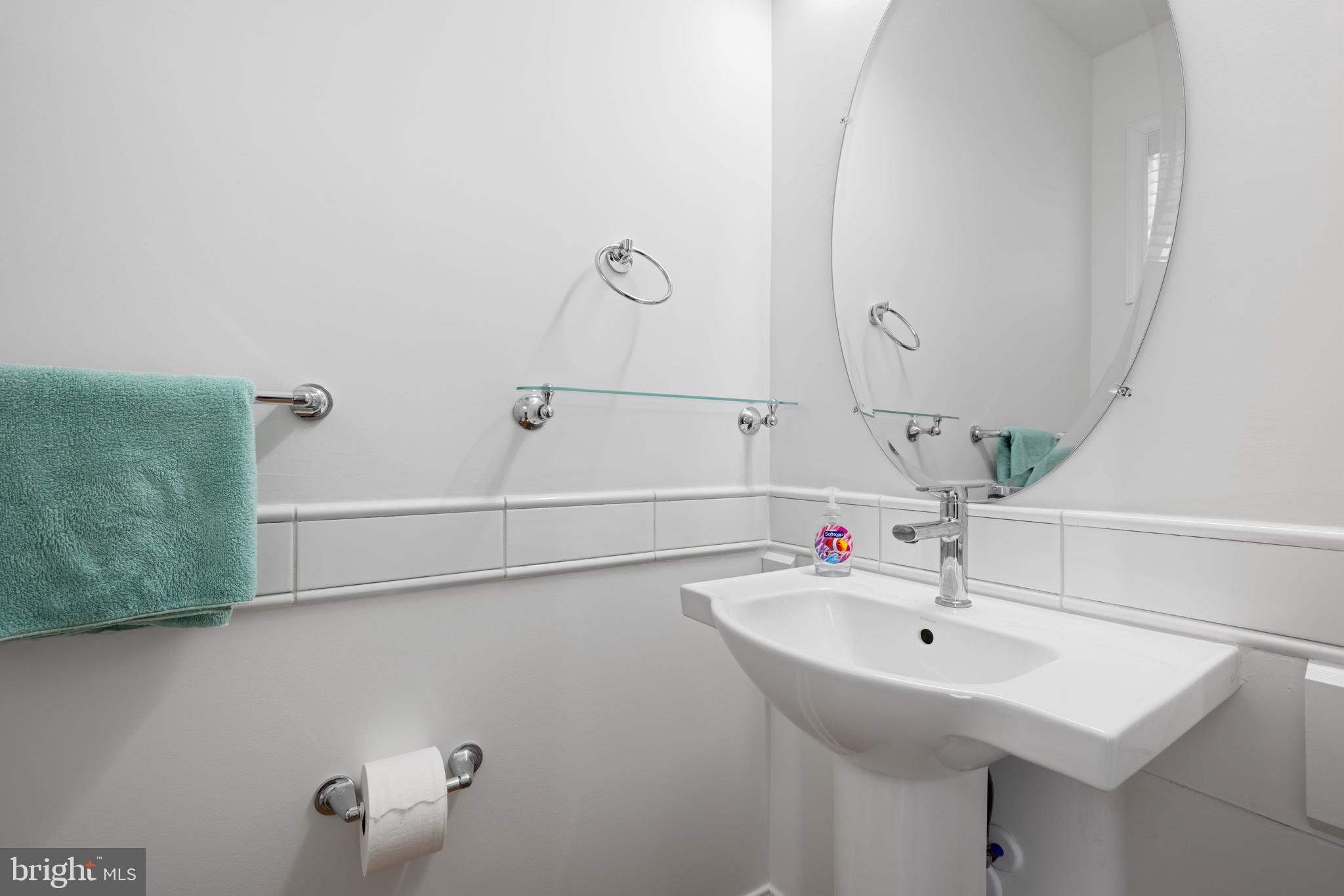 25304 Razorbill Court Millsboro, DE 19966 - Photo 23 of 45 a bathroom with a sink and mirror