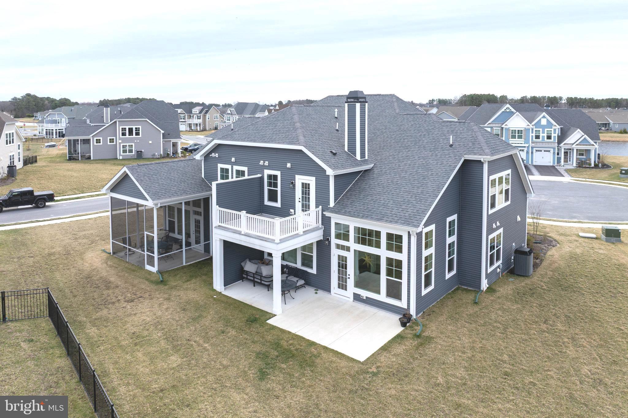25304 Razorbill Court Millsboro, DE 19966 - Photo 26 of 45 a view of a large building with a mountain in the background