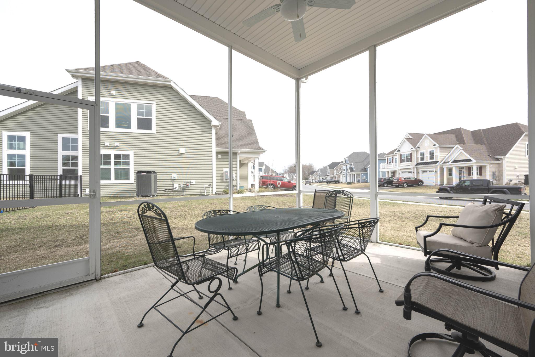 25304 Razorbill Court Millsboro, DE 19966 - Photo 30 of 45 a view of a terrace with furniture and stove