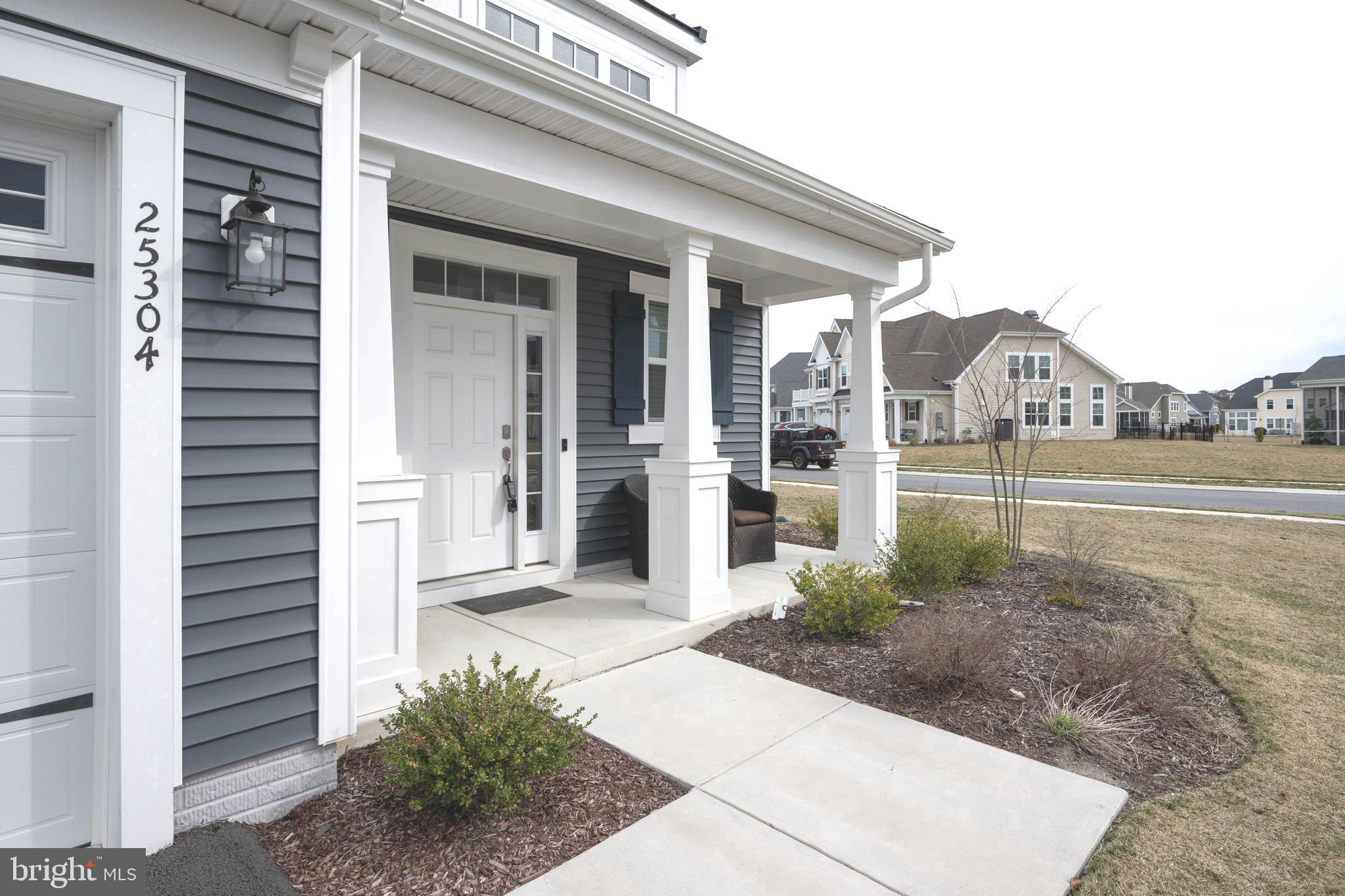 25304 Razorbill Court Millsboro, DE 19966 - Photo 32 of 45 a view of a house with backyard and porch