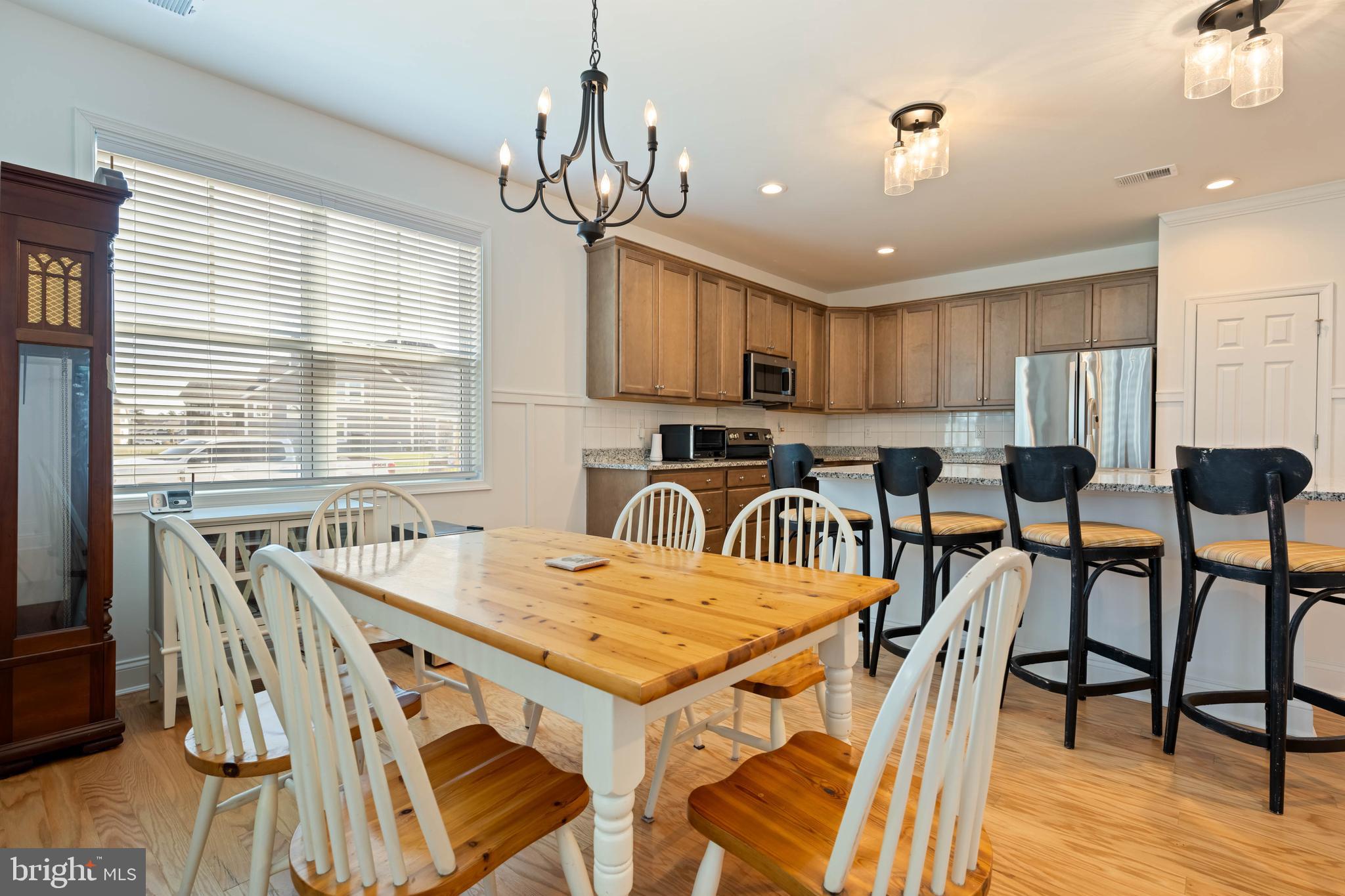 25304 Razorbill Court Millsboro, DE 19966 - Photo 6 of 45 a view of a dining room with furniture window and wooden floor