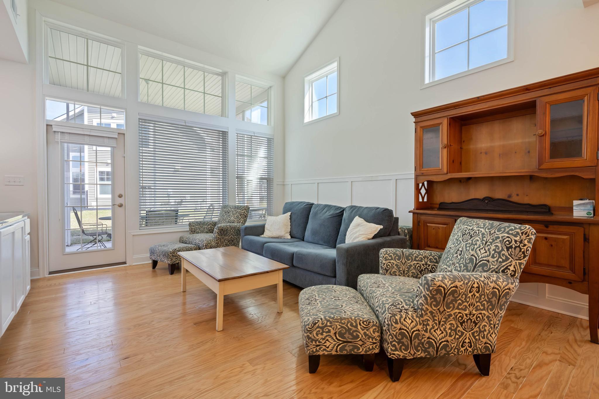 25304 Razorbill Court Millsboro, DE 19966 - Photo 9 of 45 a living room with furniture and a flat screen tv