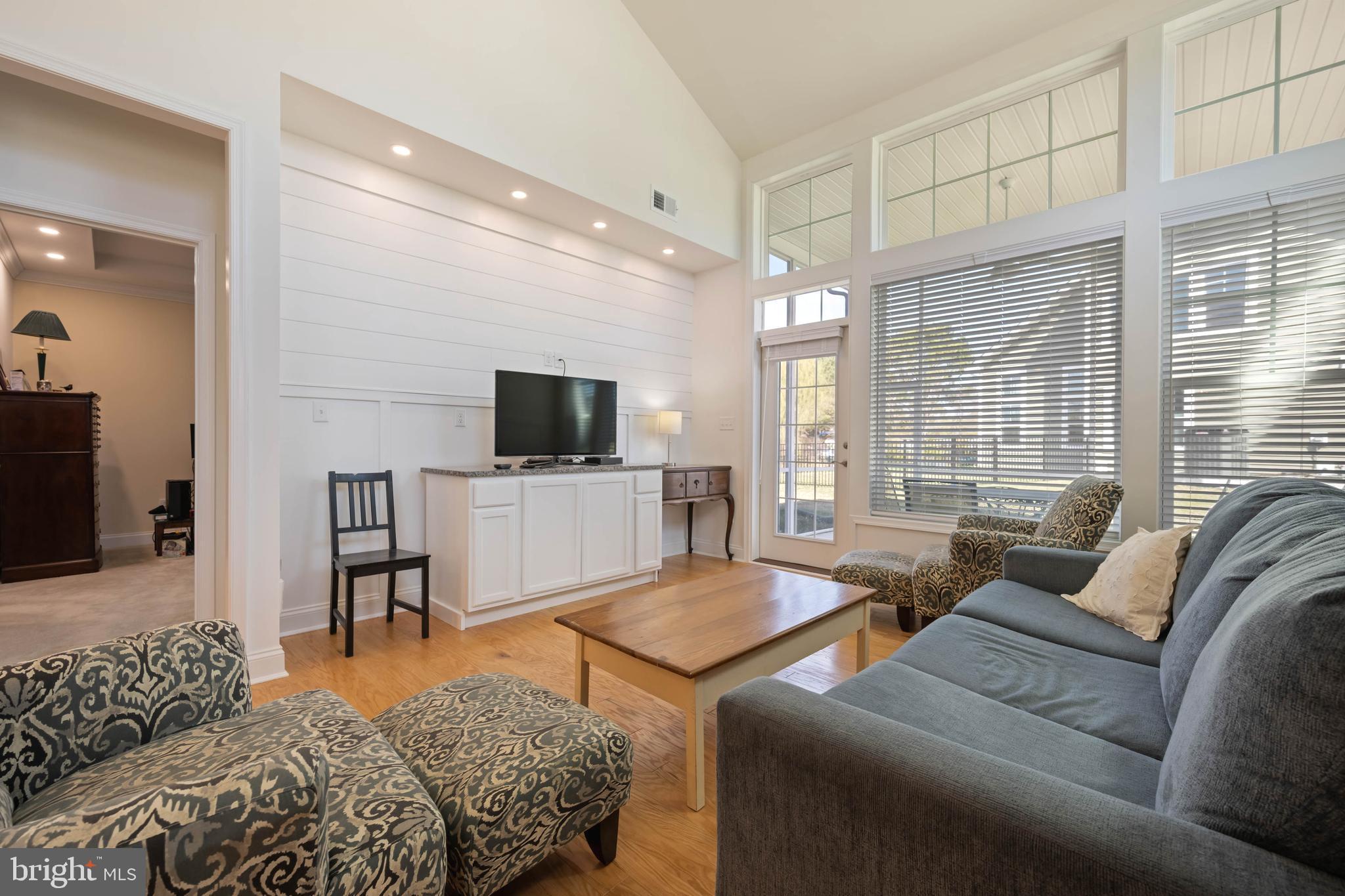 25304 Razorbill Court Millsboro, DE 19966 - Photo 10 of 45 a living room with furniture and a flat screen tv