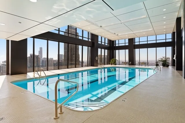 a bathroom with a double vanity sink a toilet and a mirror