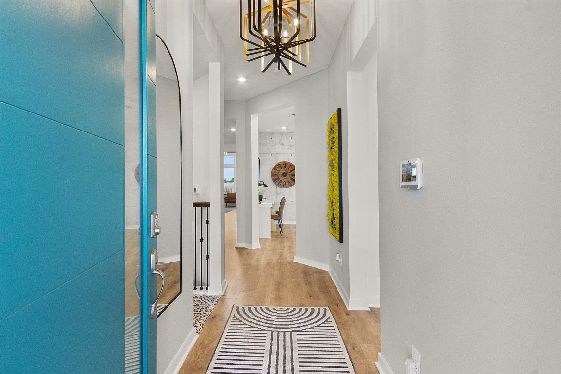 120 Pipe Cactus Pass Georgetown, TX 78633 - Photo 17 of 35 a view of a hallway with wooden floor and a bathroom