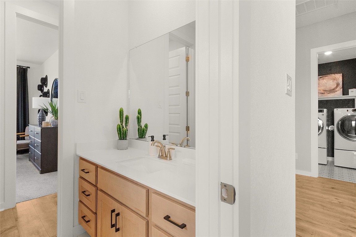 120 Pipe Cactus Pass Georgetown, TX 78633 - Photo 20 of 35 a bathroom with a sink and a mirror