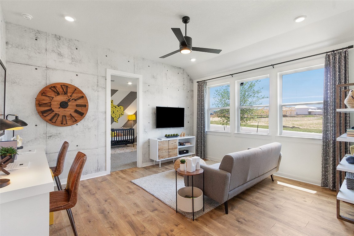 120 Pipe Cactus Pass Georgetown, TX 78633 - Photo 22 of 35 a living room with furniture and a flat screen tv