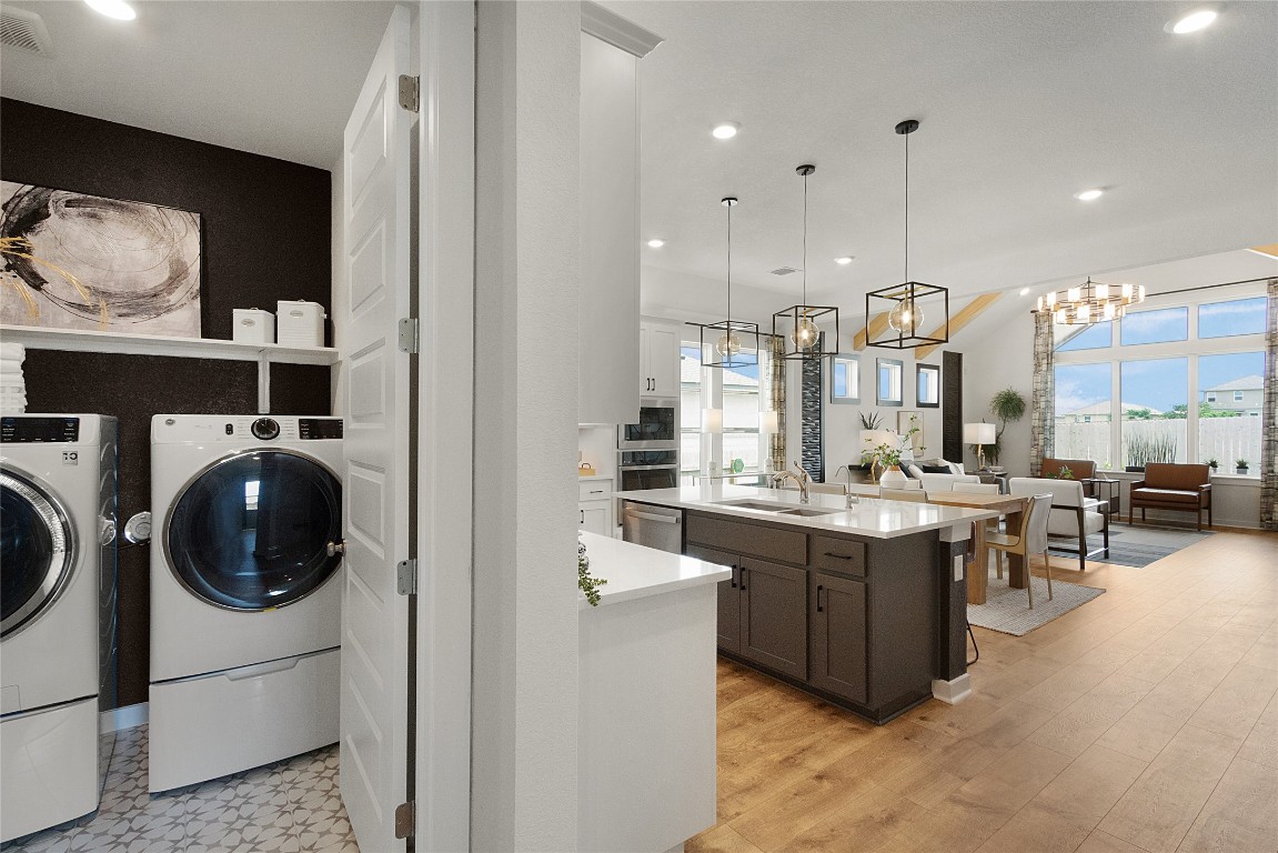 120 Pipe Cactus Pass Georgetown, TX 78633 - Photo 24 of 35 a view of a kitchen center island and living room