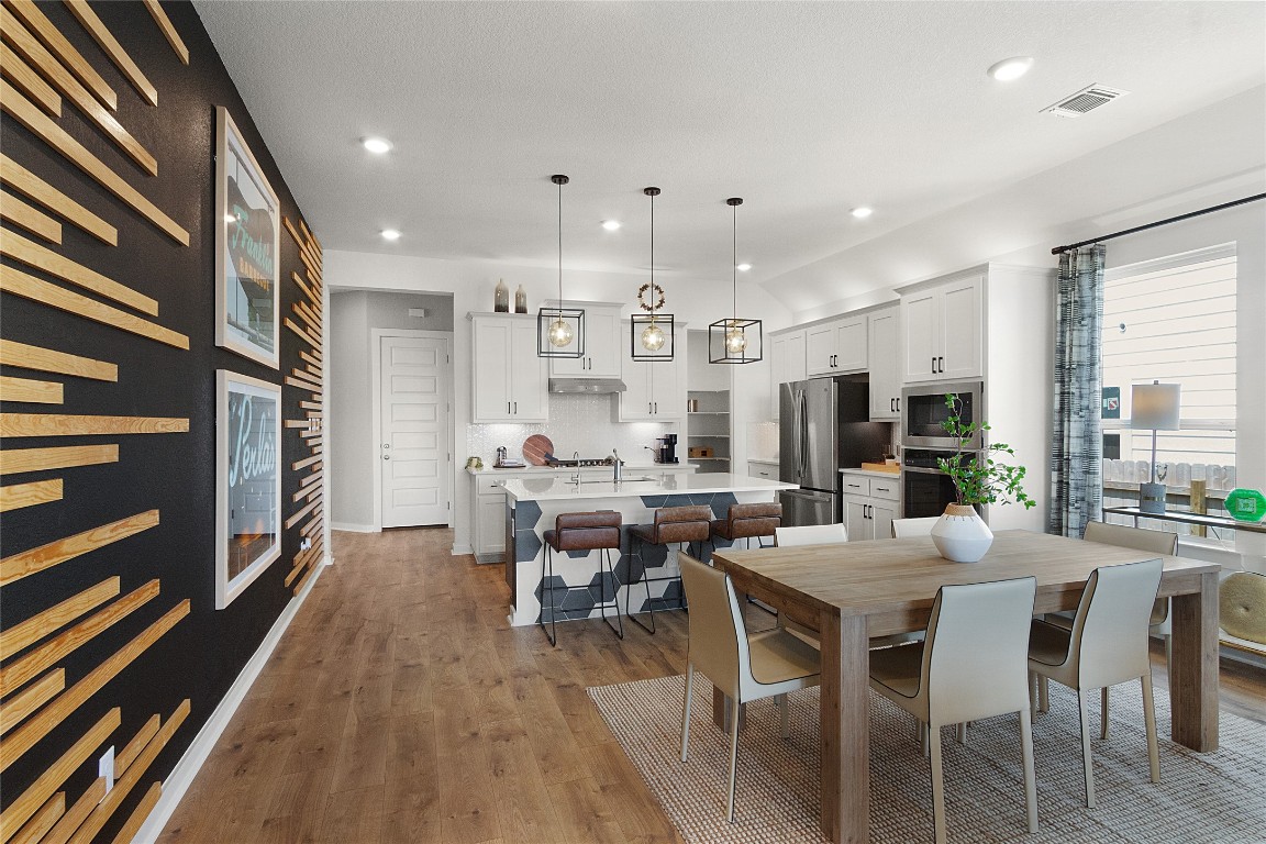 120 Pipe Cactus Pass Georgetown, TX 78633 - Photo 29 of 35 a large kitchen with a table and chairs