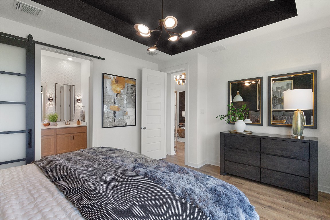 120 Pipe Cactus Pass Georgetown, TX 78633 - Photo 32 of 35 a bedroom with a large bed and a dresser