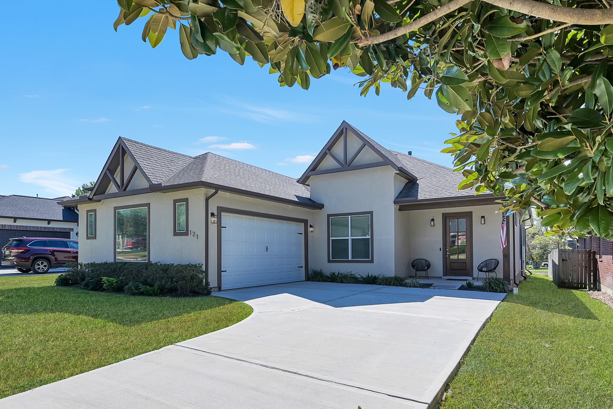 121 Bermuda Circle Montgomery, TX 77356 - Photo 1 of 44 a front view of a house with a garden and yard