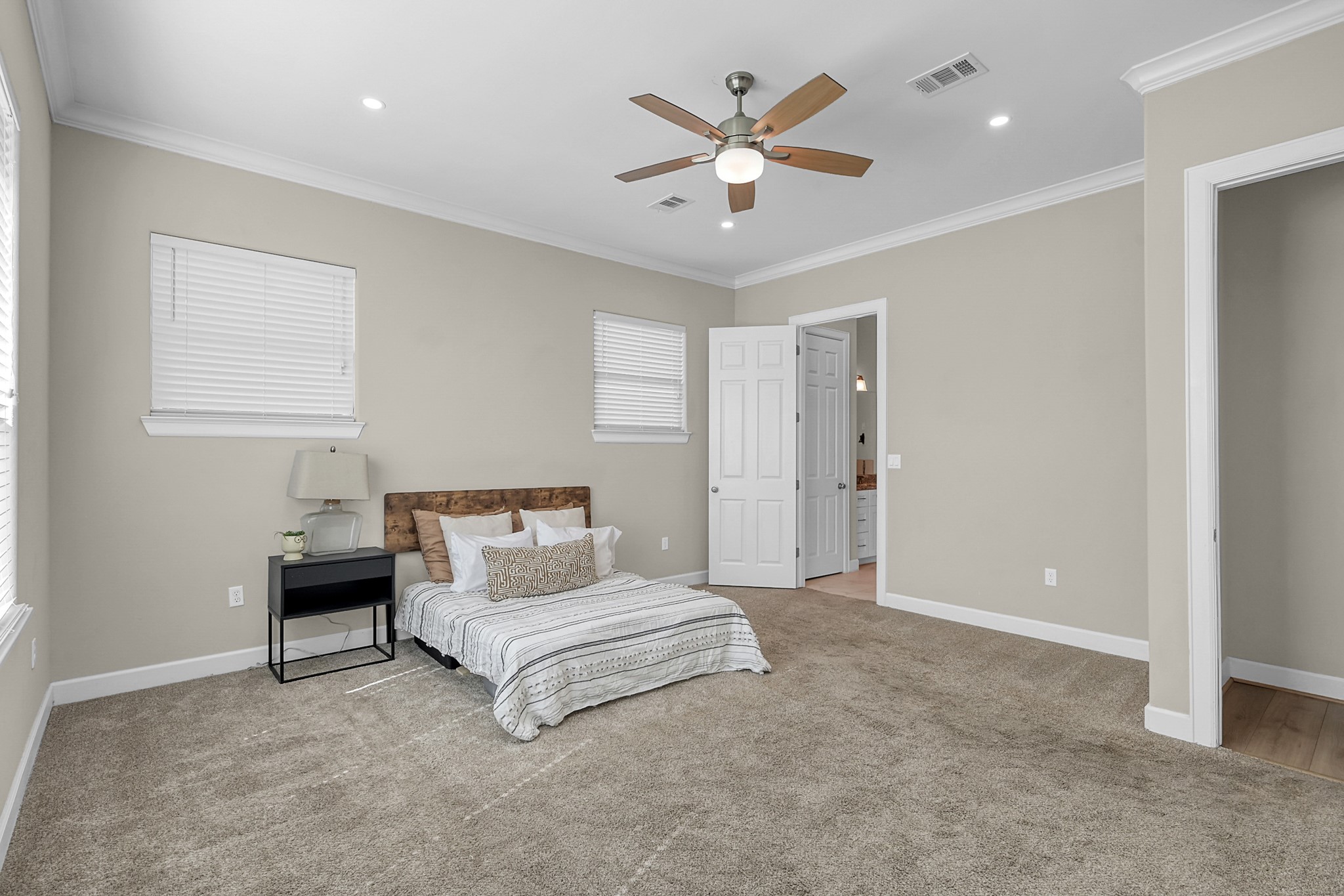 121 Bermuda Circle Montgomery, TX 77356 - Photo 23 of 44 a bedroom with a bed and a ceiling fan