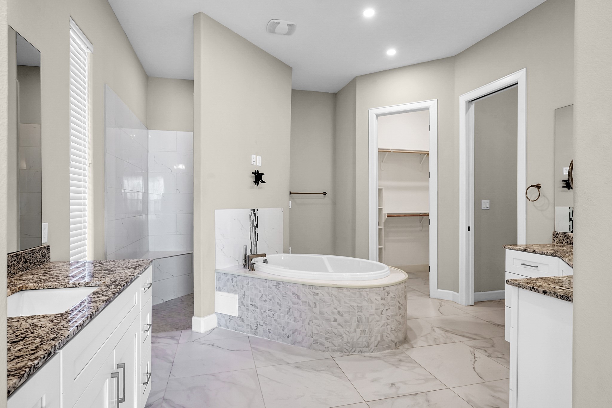 121 Bermuda Circle Montgomery, TX 77356 - Photo 25 of 44 a spacious bathroom with a granite countertop sink a toilet a mirror and bathtub