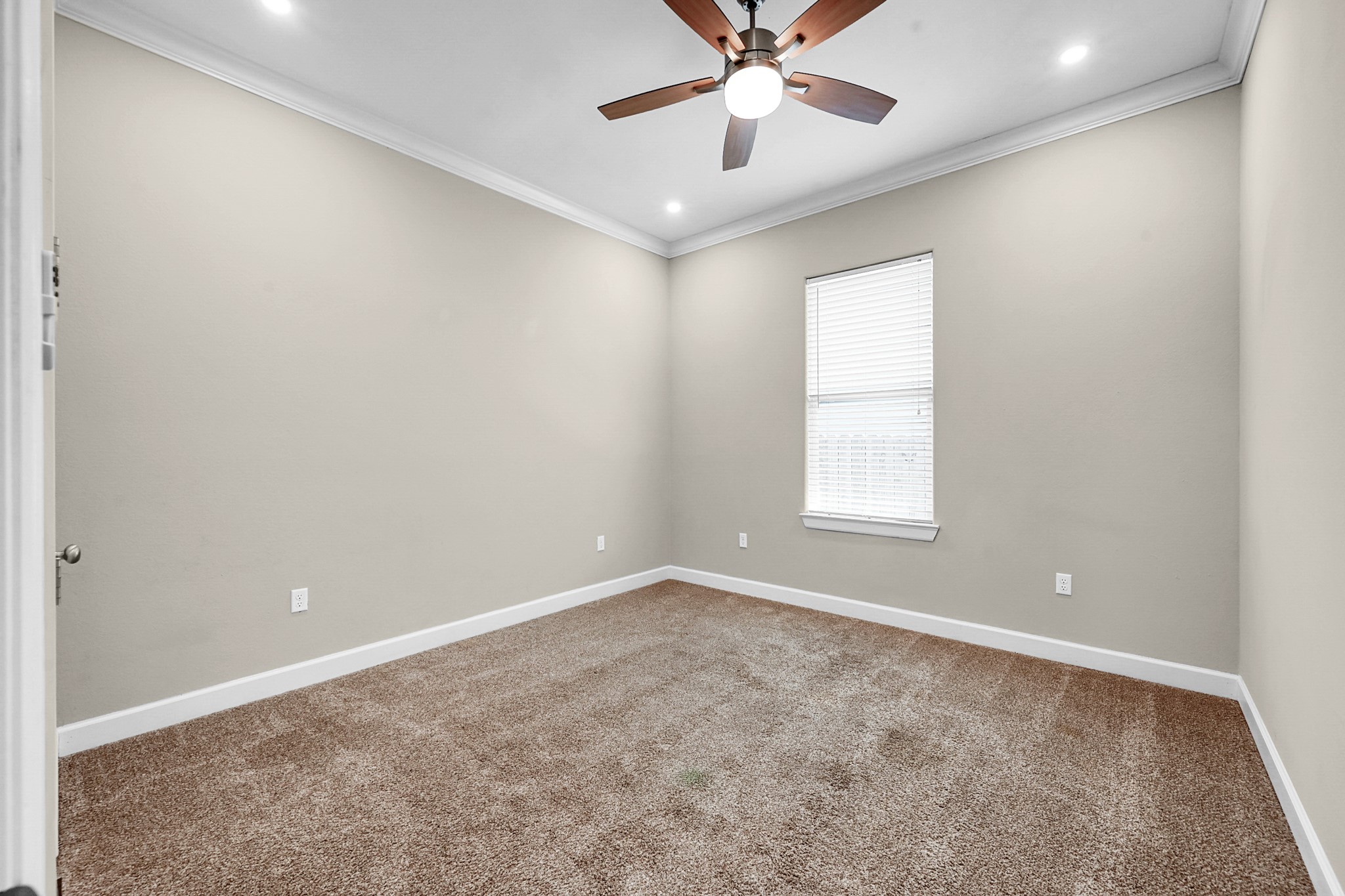 121 Bermuda Circle Montgomery, TX 77356 - Photo 30 of 44 an empty room with a window and a fan