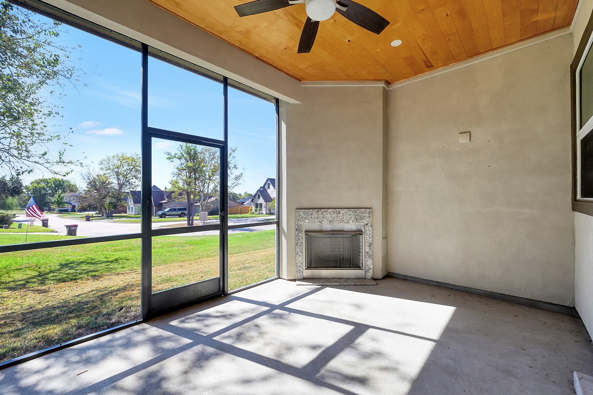 121 Bermuda Circle Montgomery, TX 77356 - Photo 36 of 44 a view of an empty room with a fireplace and a ceiling fan