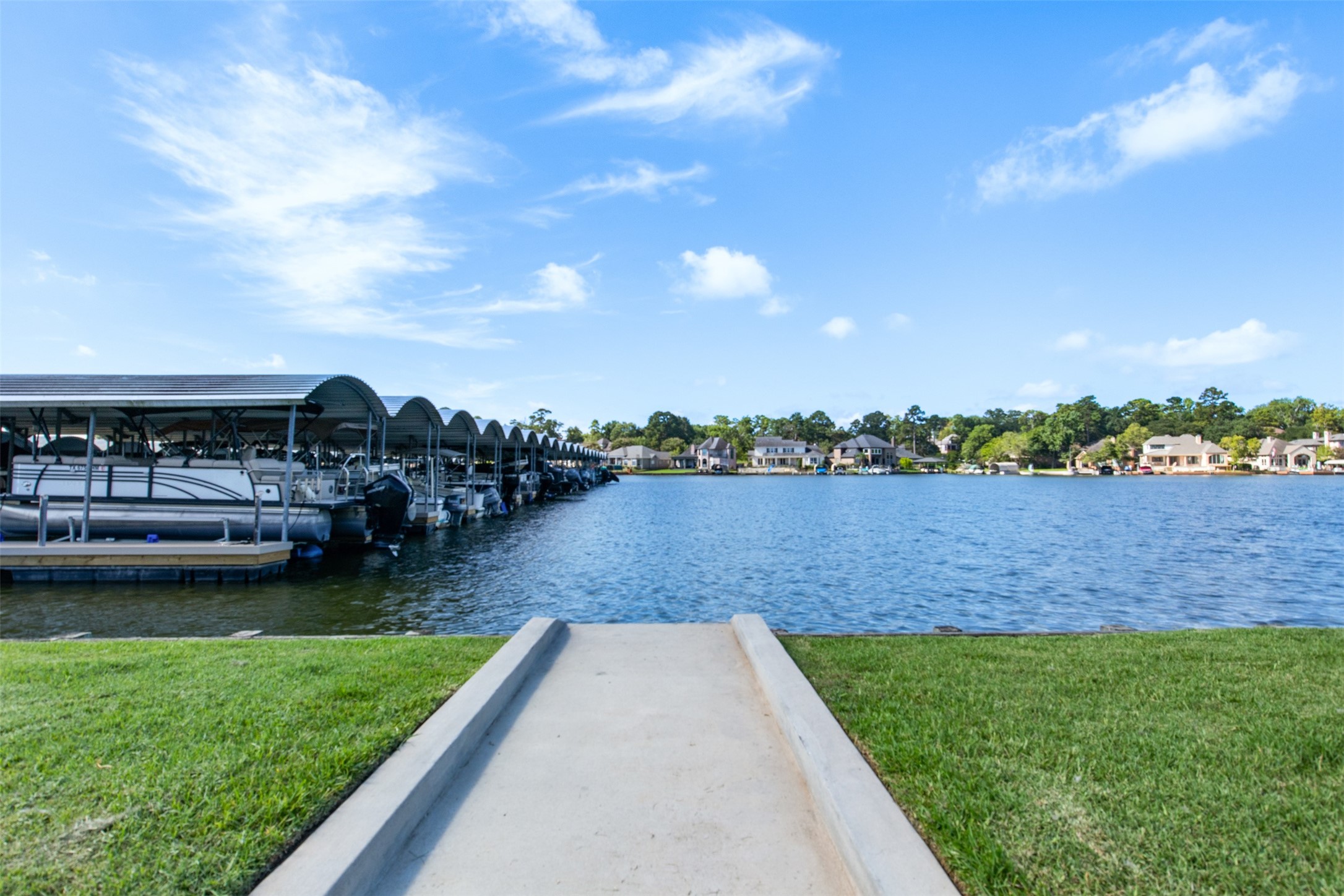 121 Bermuda Circle Montgomery, TX 77356 - Photo 40 of 44 a view of a lake with houses in the back